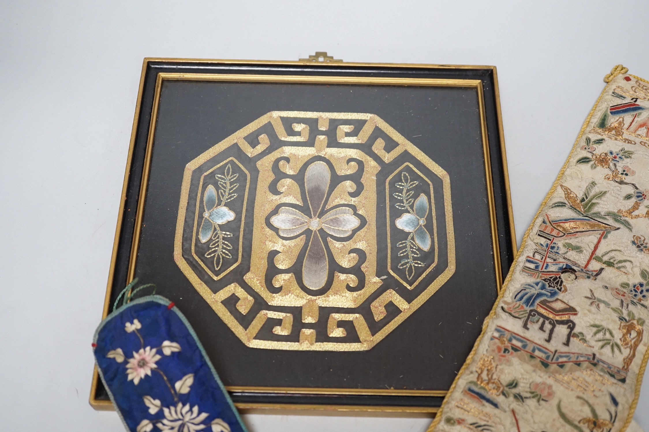 A pair of Chinese 19th century figurative sleeve bands, embroidered with polychrome and metallic threads, stitched in Peking knot and a Chinese embroidered silk purse, with a later panel, (3)